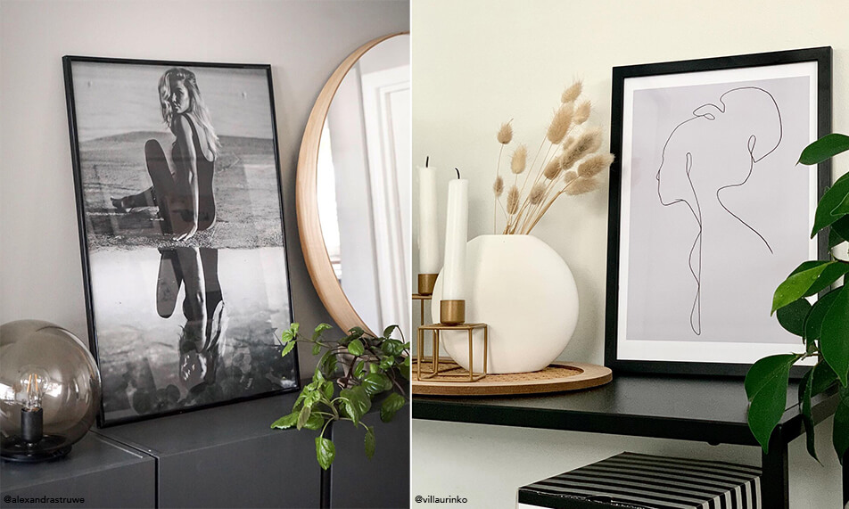 Arredamento minimalista con cornici nere e piante verdi