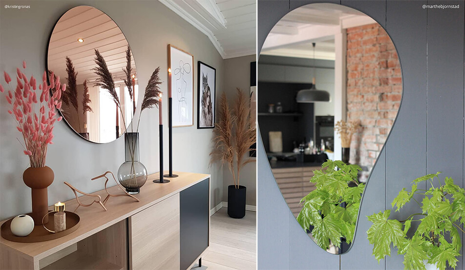 Specchio rotondo in oro rosa contro parete grigia - specchio a forma di goccia contro parete grigia